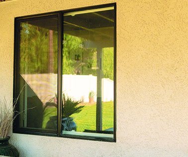 Example of a flush, minimal-frame window — glass sits at the exterior wall plane with a thin frame