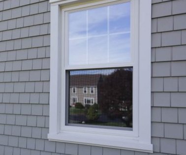 Example of a full-frame, recessed window — set into the wall with visible trim and sill